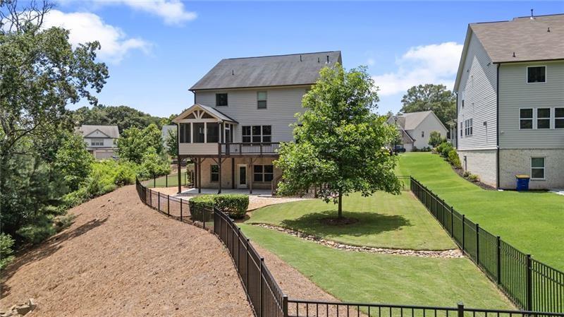 4105 Bellehurst Lane Cumming, GA 30040 - Photo 45 of 48 a view of a house with a yard