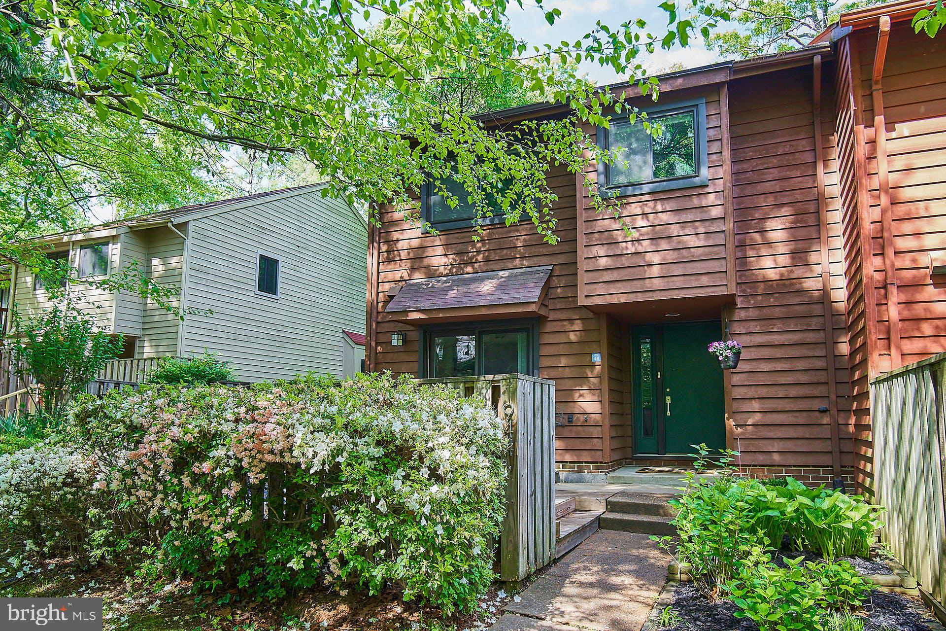 1944 Winterport Cluster Reston, VA 20191 - Photo 1 of 35 a front view of a house with garden