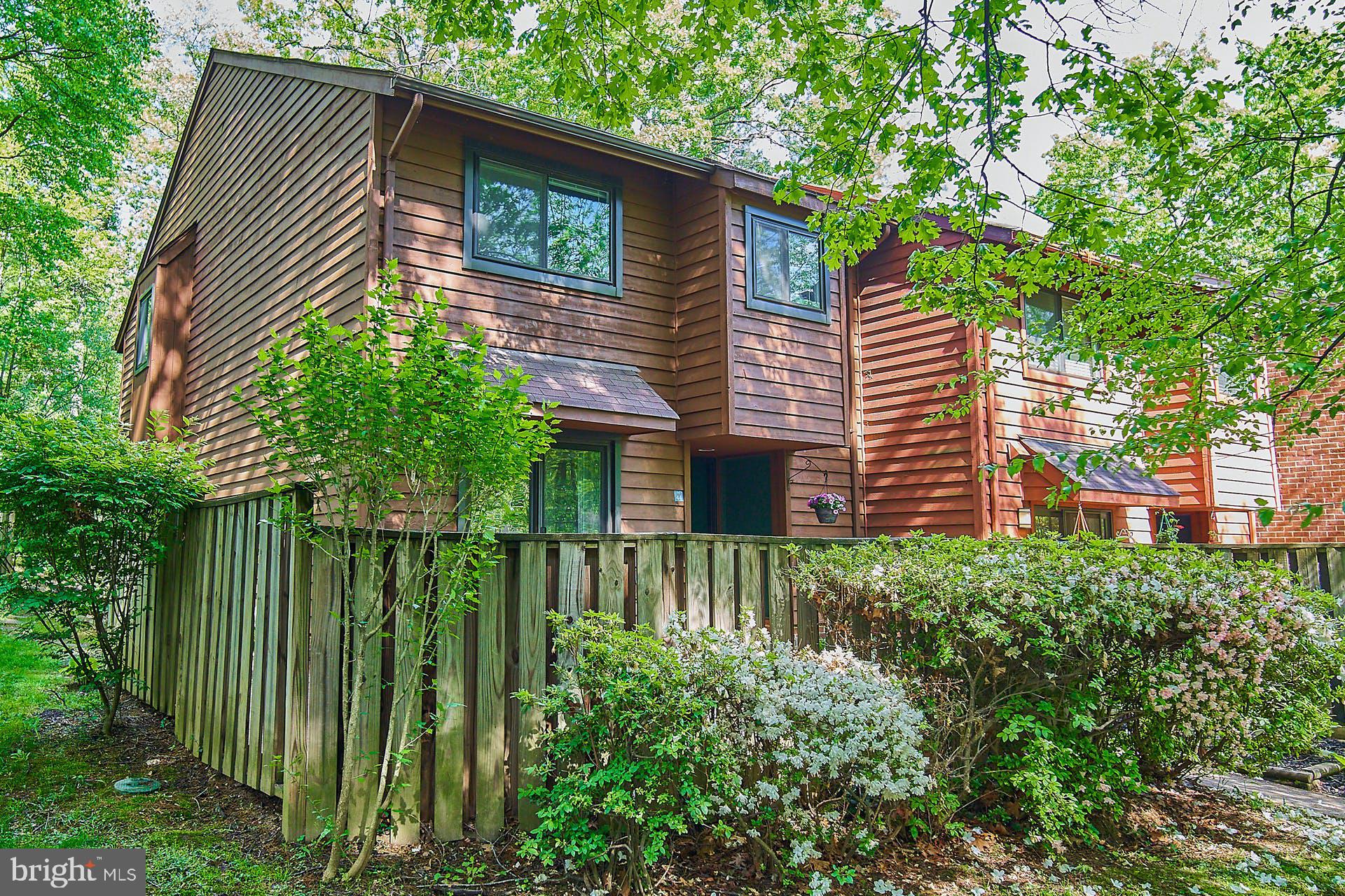 1944 Winterport Cluster Reston, VA 20191 - Photo 2 of 35 a backyard of a house with plants and tree