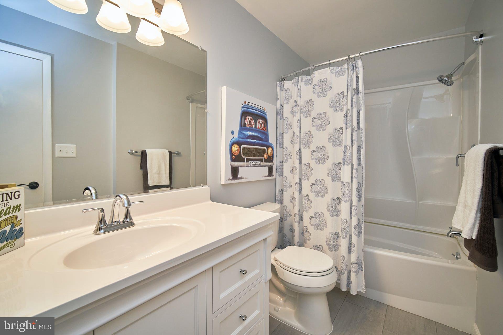 1944 Winterport Cluster Reston, VA 20191 - Photo 18 of 35 a bathroom with a sink a toilet and shower