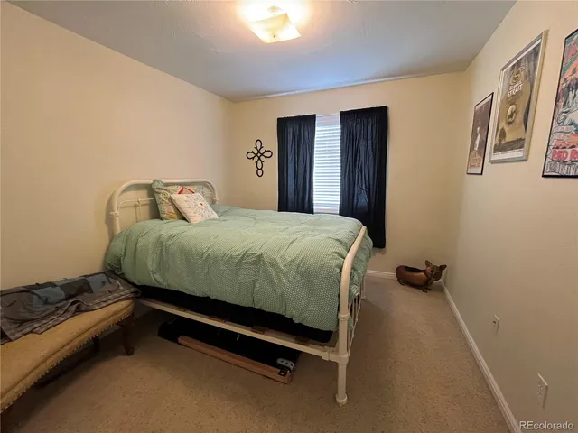 a bedroom with a bed and a cabinets