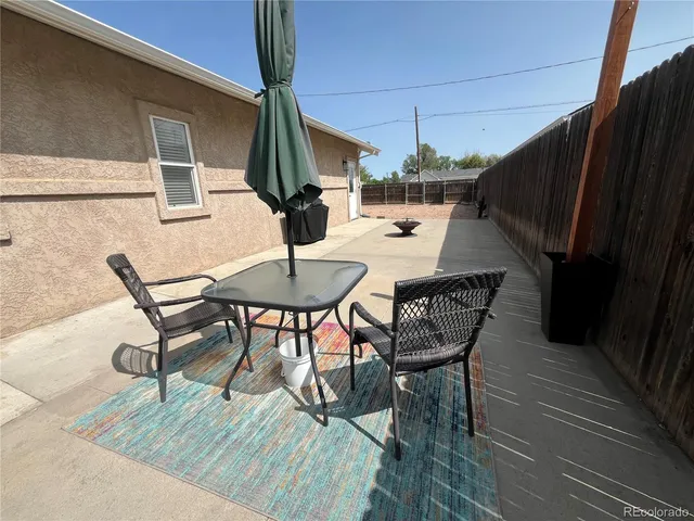 a view of a tables and chairs in patio