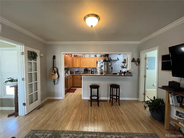 a view of dining room with furniture and wooden floor