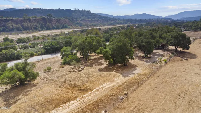 a view of a road with mountains in the background
