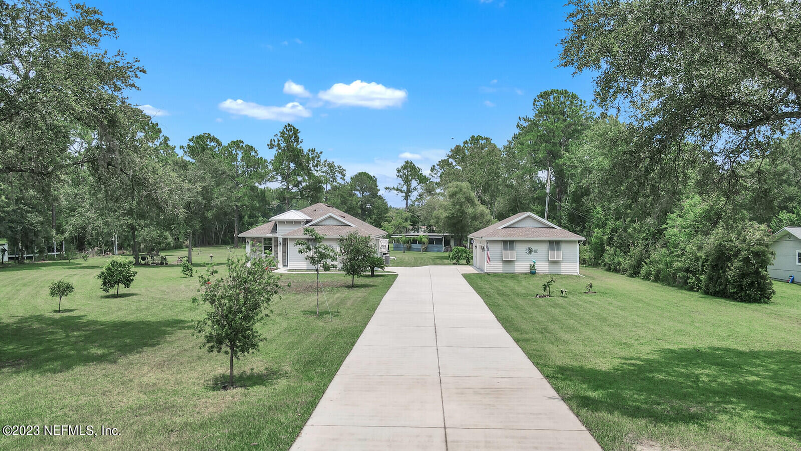 1521 Lee Road St. Johns, FL 32259 - Photo 1 of 38 a front view of a house with a yard and trees