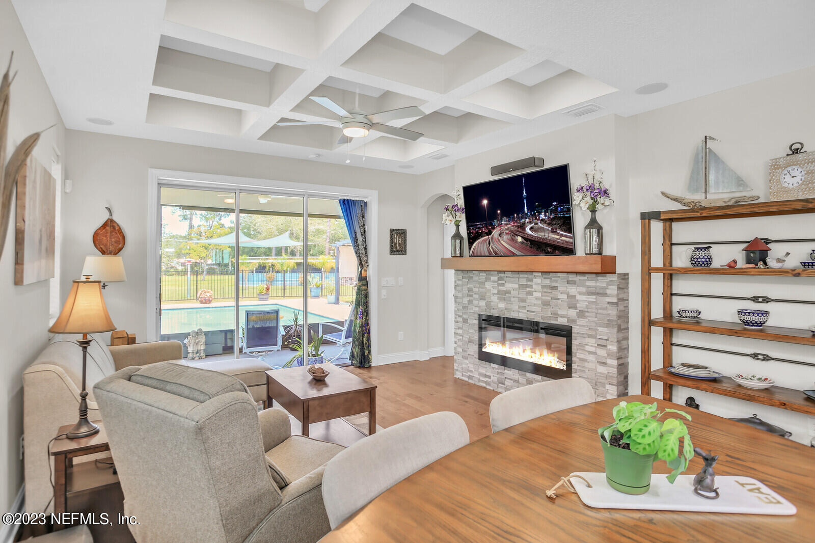 1521 Lee Road St. Johns, FL 32259 - Photo 11 of 38 a living room with furniture a fireplace and a flat screen tv