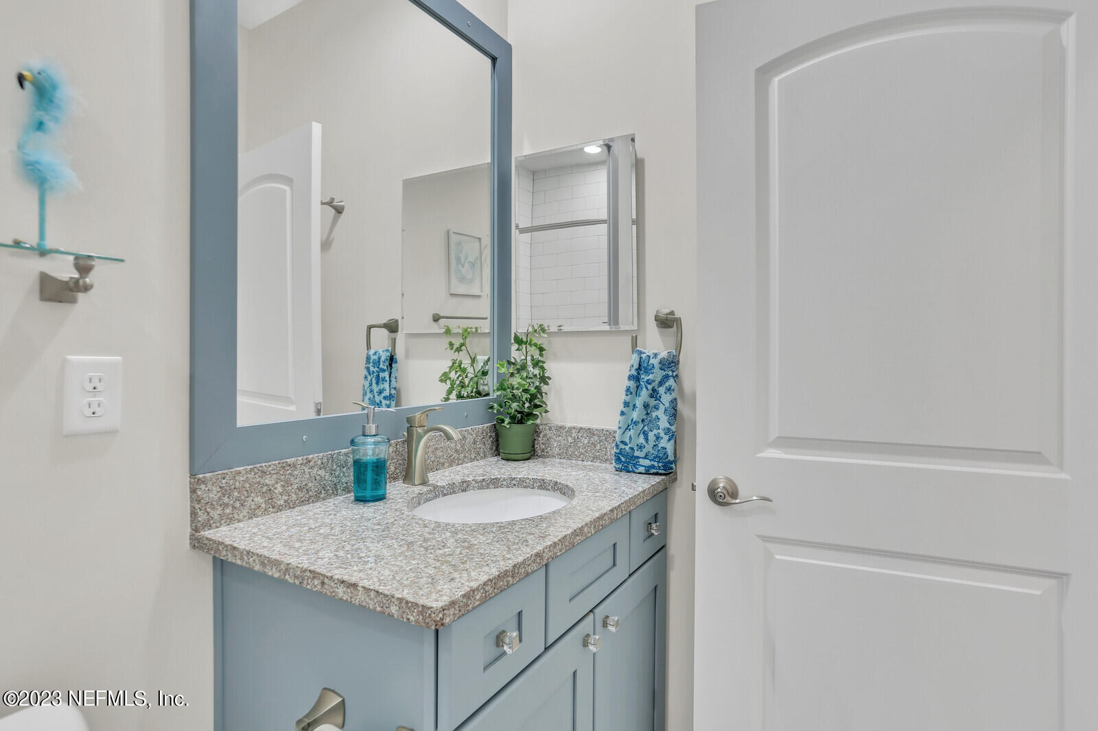 1521 Lee Road St. Johns, FL 32259 - Photo 20 of 38 a bathroom with a granite countertop sink and a mirror