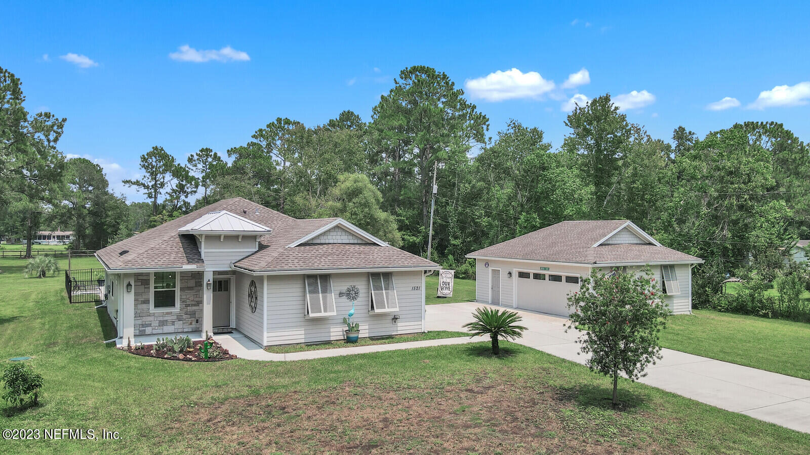 1521 Lee Road St. Johns, FL 32259 - Photo 2 of 38 a front view of a house with garden