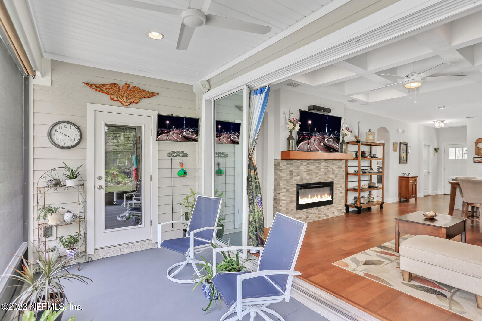 1521 Lee Road St. Johns, FL 32259 - Photo 23 of 38 a living room with furniture a fireplace and a table