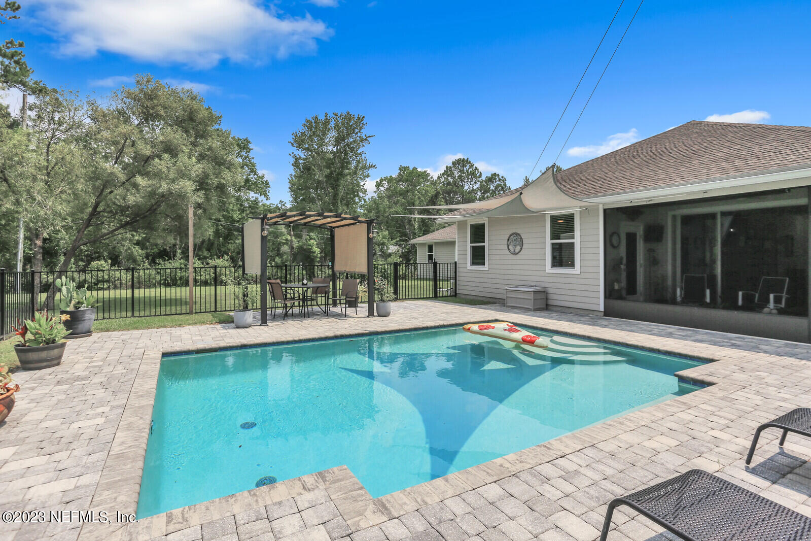 1521 Lee Road St. Johns, FL 32259 - Photo 26 of 38 a view of a house with pool and a yard