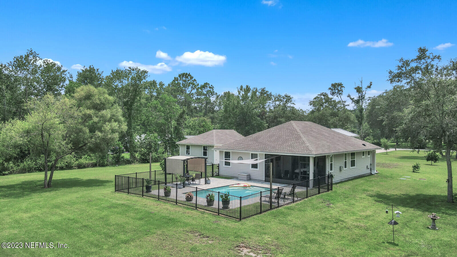 1521 Lee Road St. Johns, FL 32259 - Photo 30 of 38 a view of a house with a backyard and a sitting area