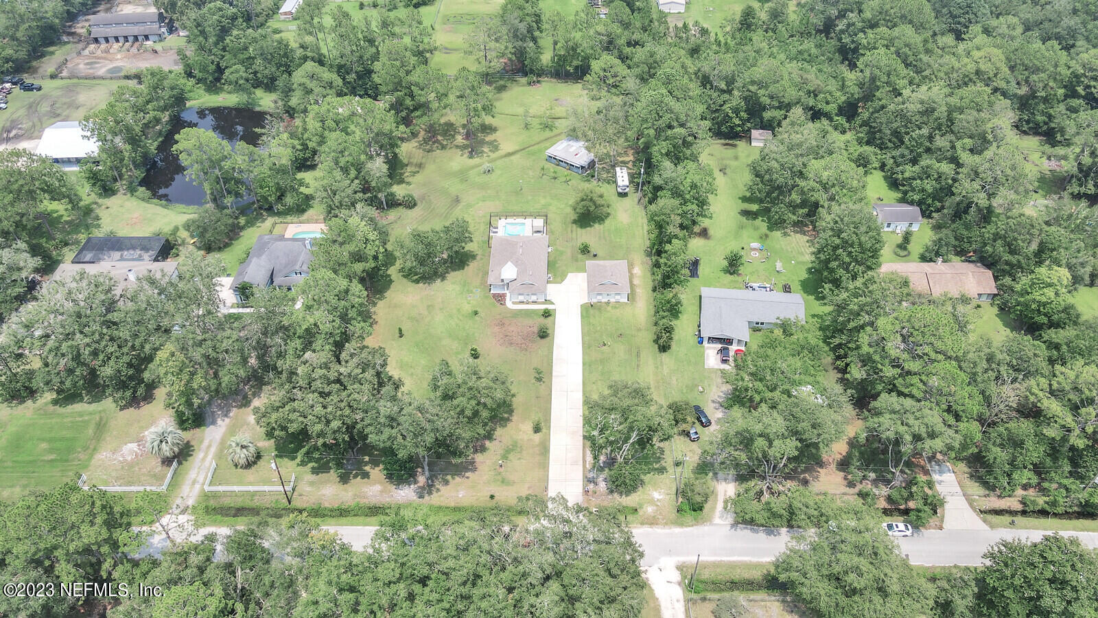 1521 Lee Road St. Johns, FL 32259 - Photo 37 of 38 an aerial view of residential house with outdoor space and trees all around