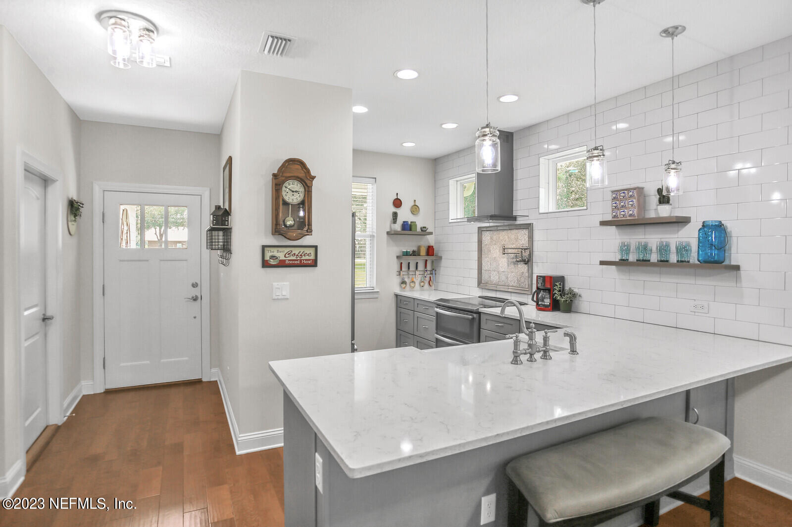 1521 Lee Road St. Johns, FL 32259 - Photo 5 of 38 a kitchen with a table chairs stove and wooden floor