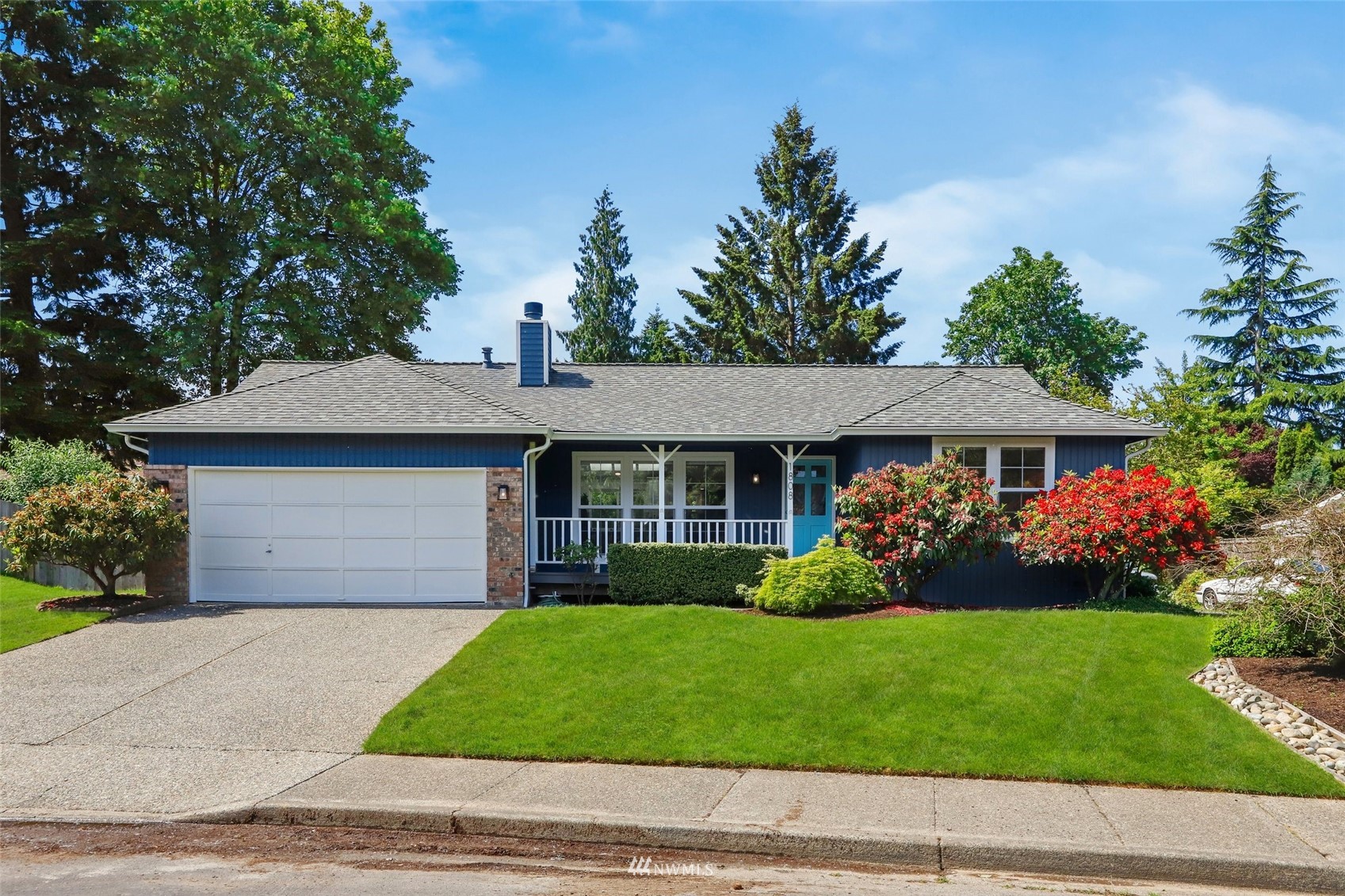 1808 243rd Place Southeast Bothell, WA 98021 - Photo 1 of 32 a front view of a house with garden