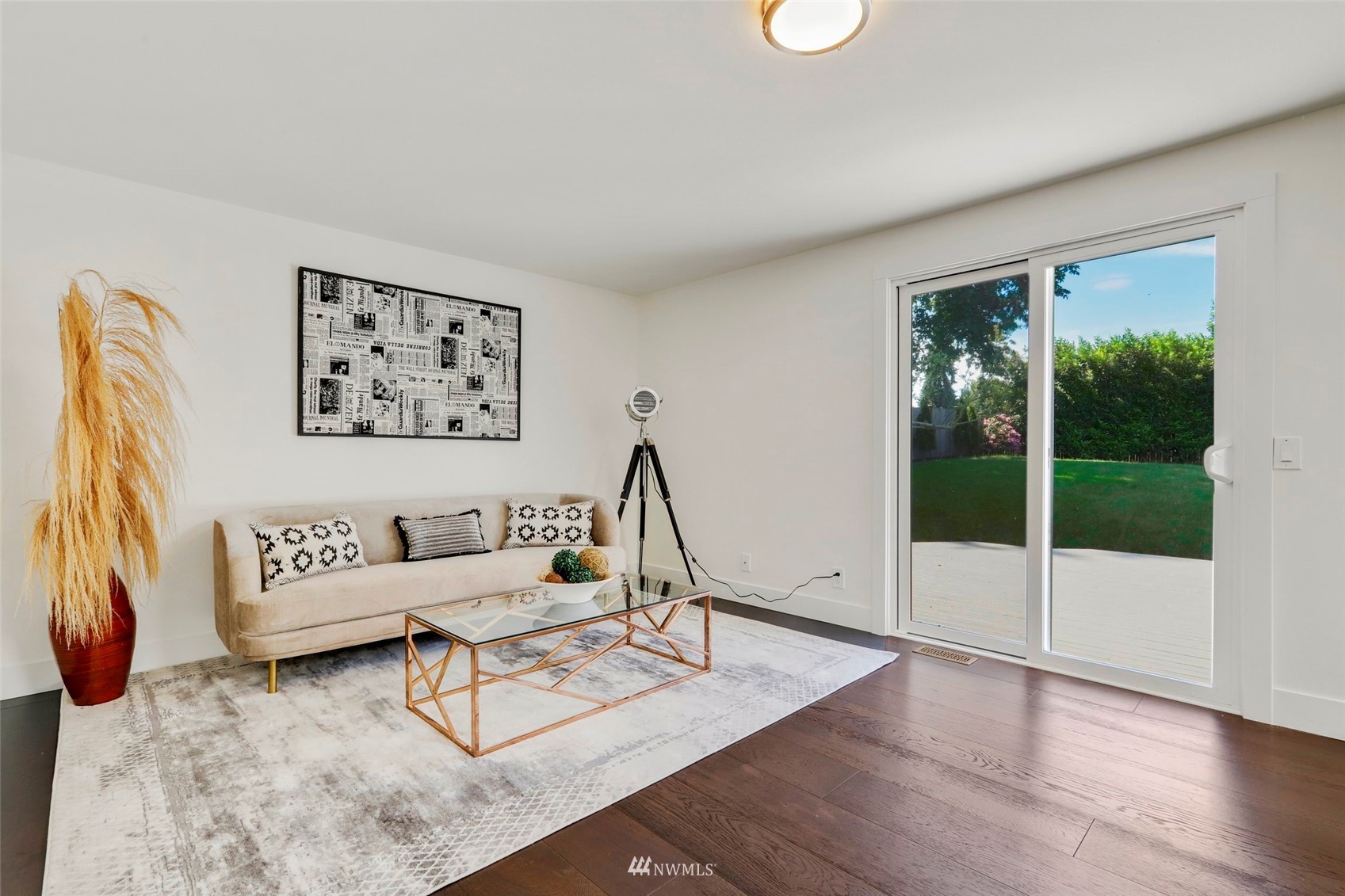 1808 243rd Place Southeast Bothell, WA 98021 - Photo 13 of 32 a living room with furniture a lamp and a potted plant