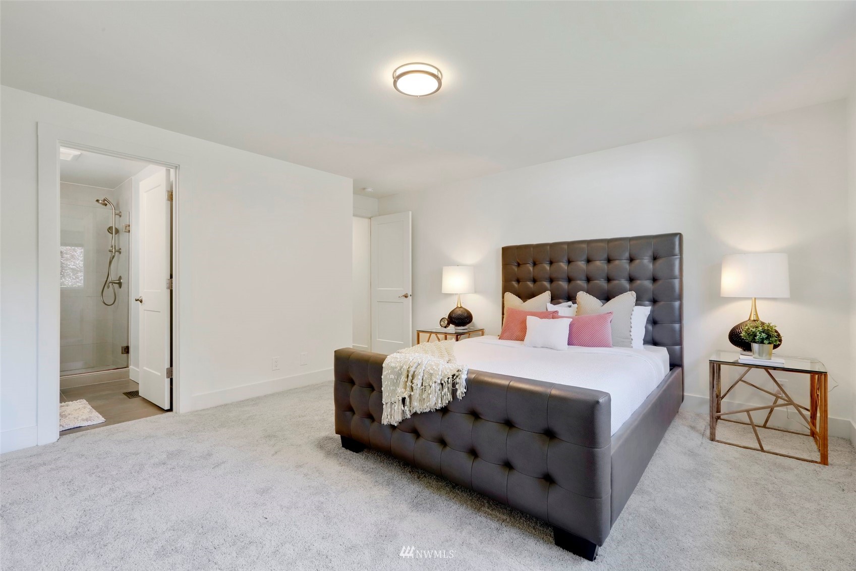 1808 243rd Place Southeast Bothell, WA 98021 - Photo 21 of 32 a bedroom with a bed and a lamp
