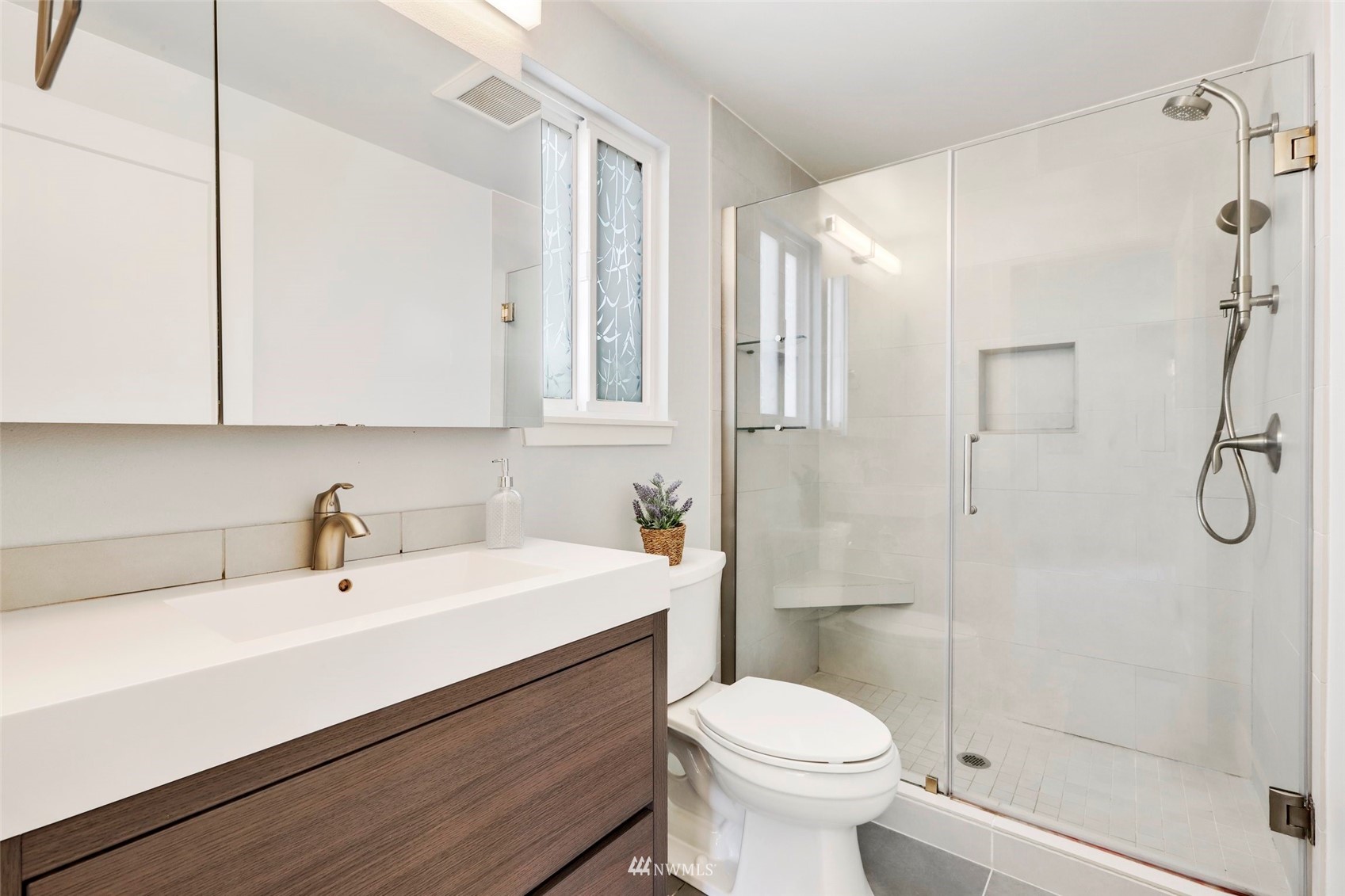 1808 243rd Place Southeast Bothell, WA 98021 - Photo 22 of 32 a bathroom with a sink a toilet and shower