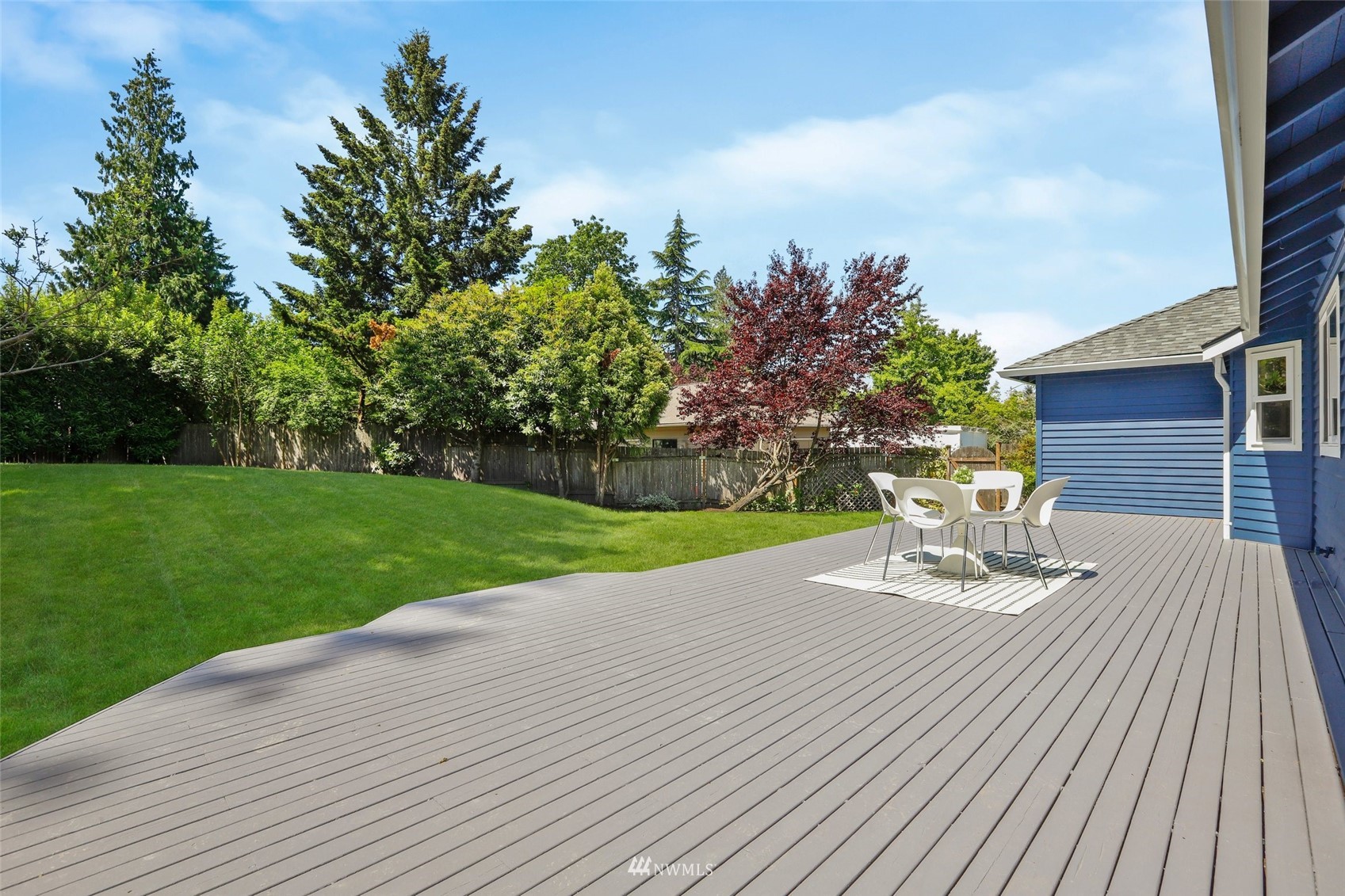 1808 243rd Place Southeast Bothell, WA 98021 - Photo 23 of 32 a view of a house with backyard sitting area and garden