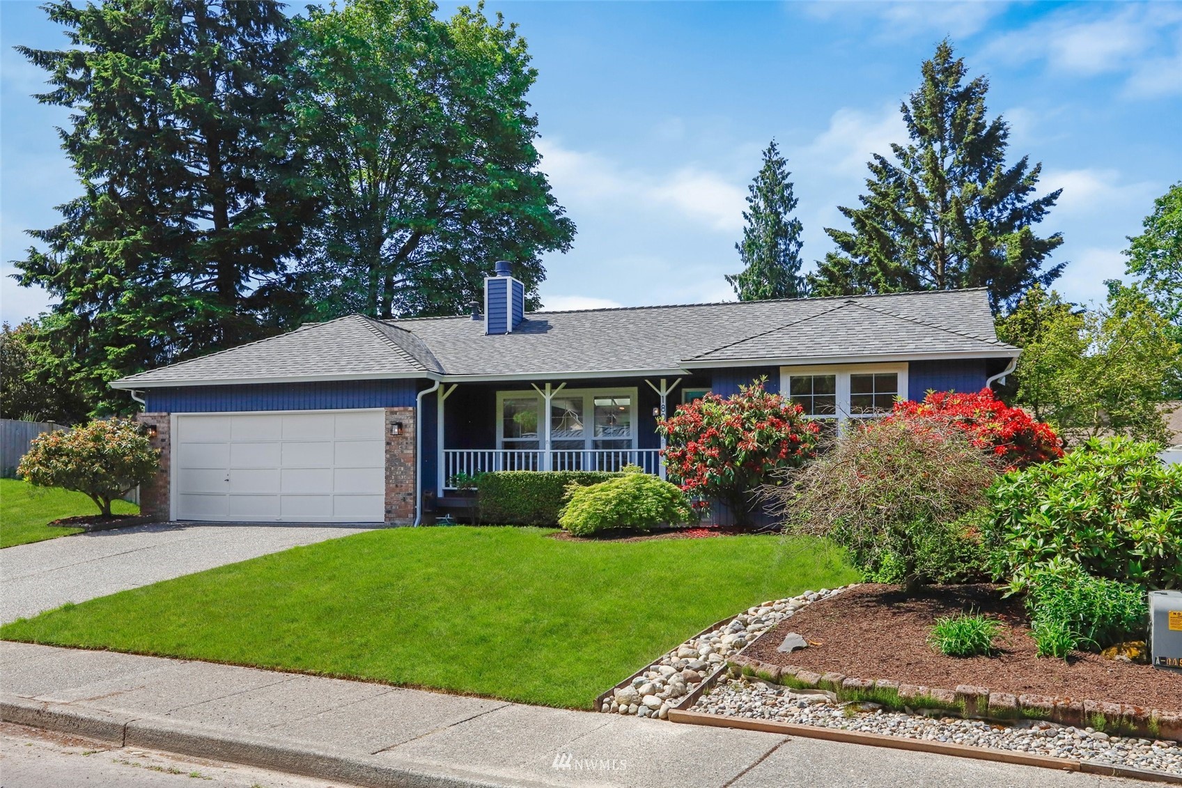 1808 243rd Place Southeast Bothell, WA 98021 - Photo 31 of 32 a front view of a house with garden