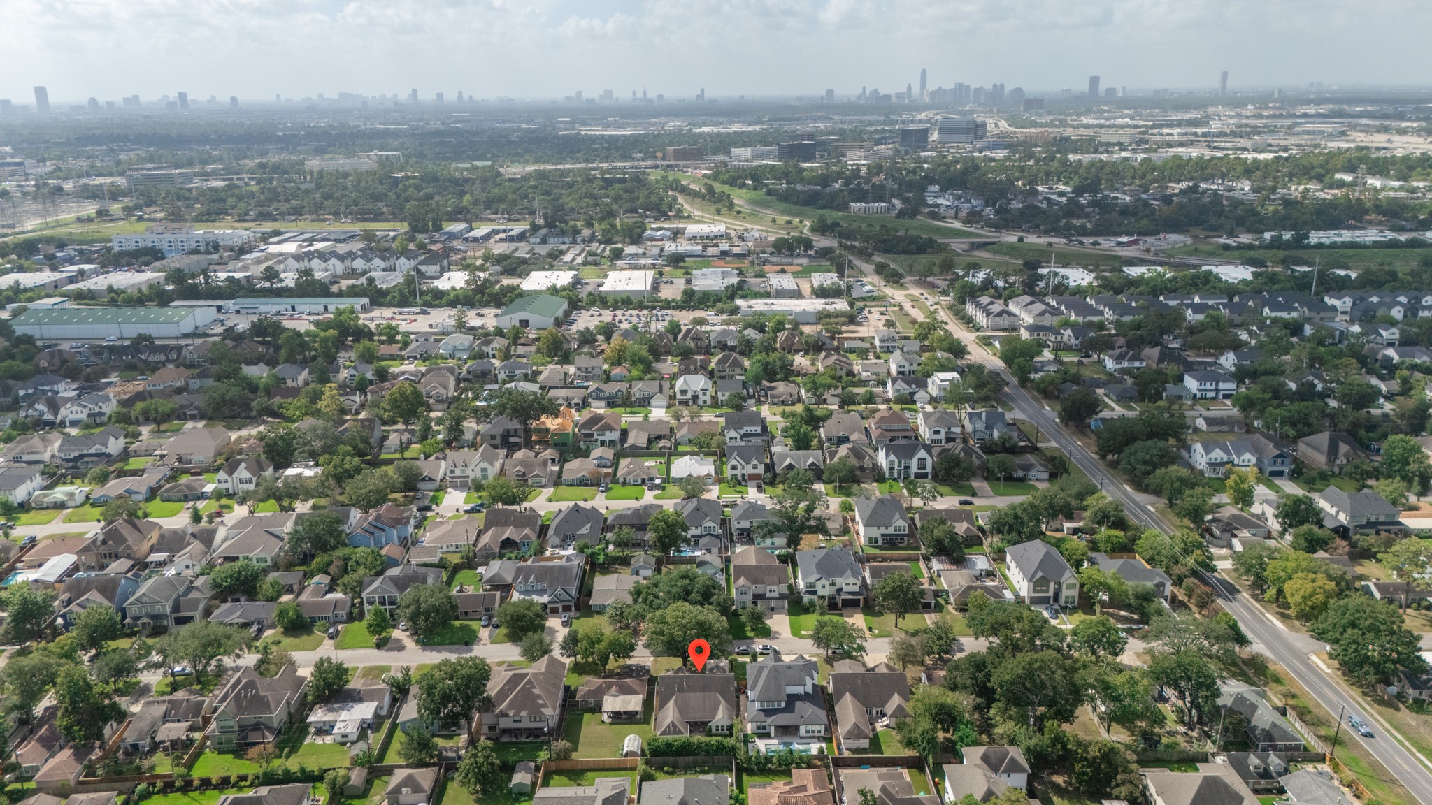 1722 Chippendale Road Houston, TX 77018 - Photo 39 of 41 Charming suburban neighborhood with tree-lined streets, surrounded by a vibrant urban landscape offering convenient access to city amenities.