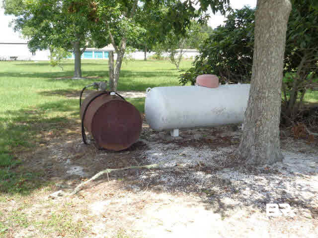 28202 Vargo Lane Elberta, AL 36530 - Photo 33 of 45 White propane gas tank. The other tank is for diesel gas used to operate the farm equipment.