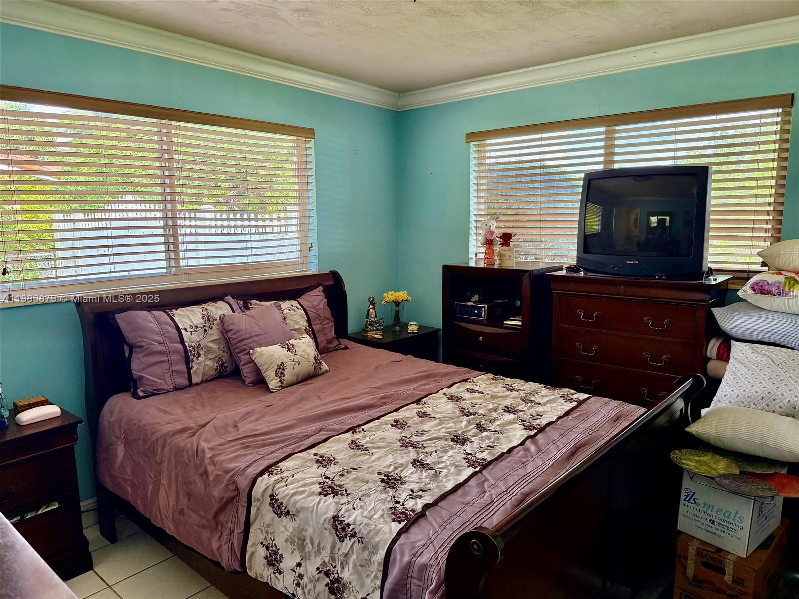 3310 Southwest 94th Place Miami, FL 33165 - Photo 13 of 24 a bedroom with a bed and a dresser