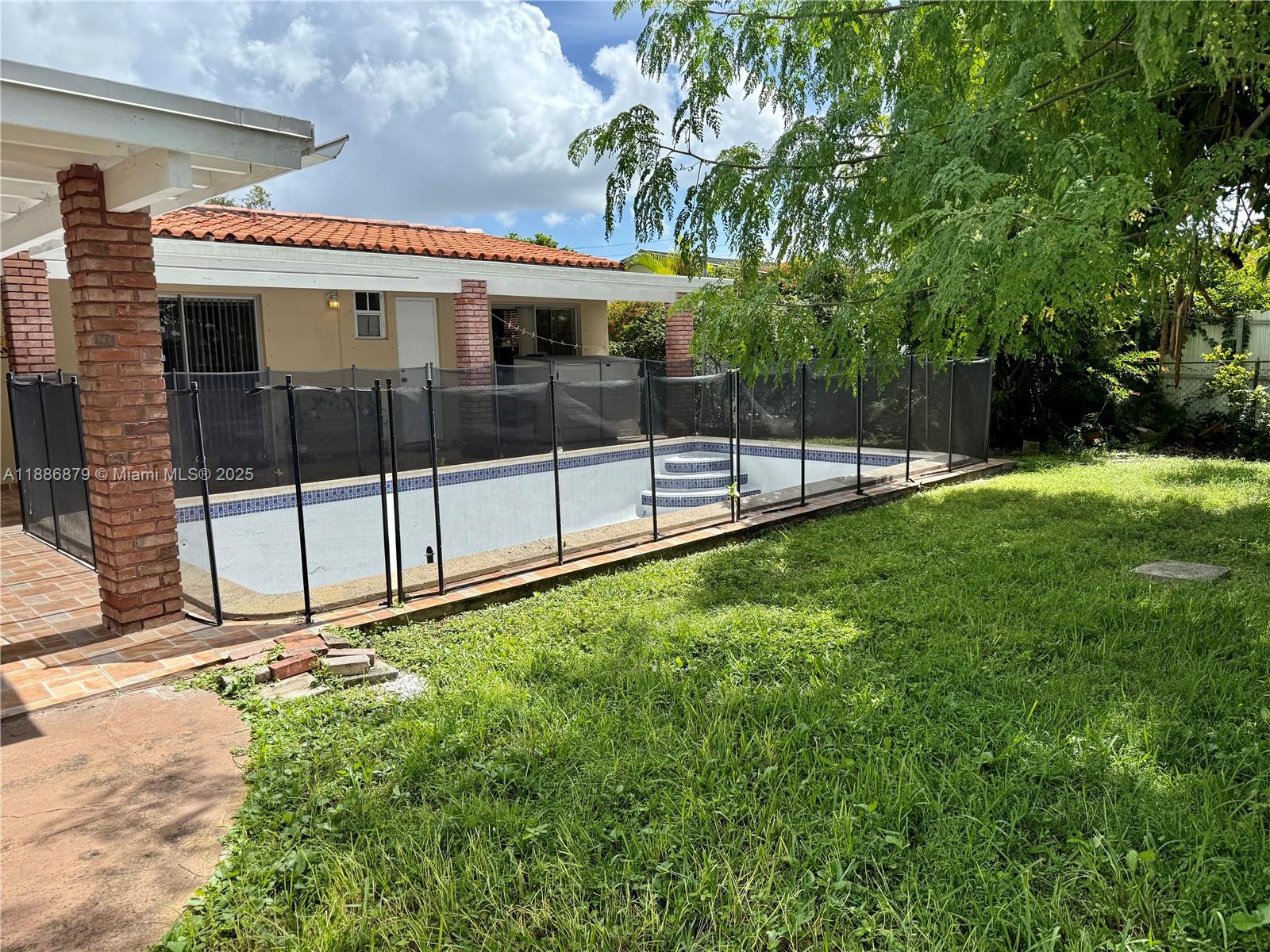 3310 Southwest 94th Place Miami, FL 33165 - Photo 21 of 24 a view of a backyard with a tv