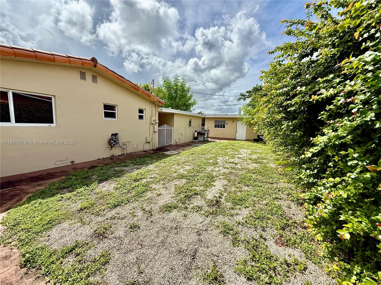 3310 Southwest 94th Place Miami, FL 33165 - Photo 6 of 24 a view of a house with a yard