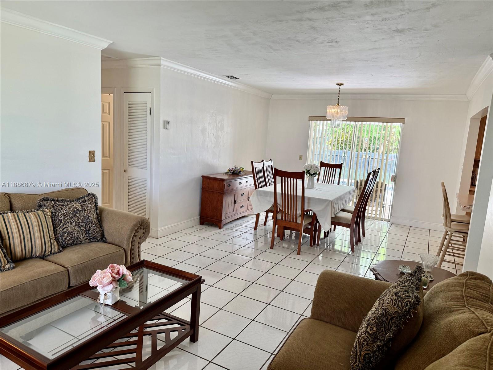 3310 Southwest 94th Place Miami, FL 33165 - Photo 7 of 24 a living room with furniture and a large window