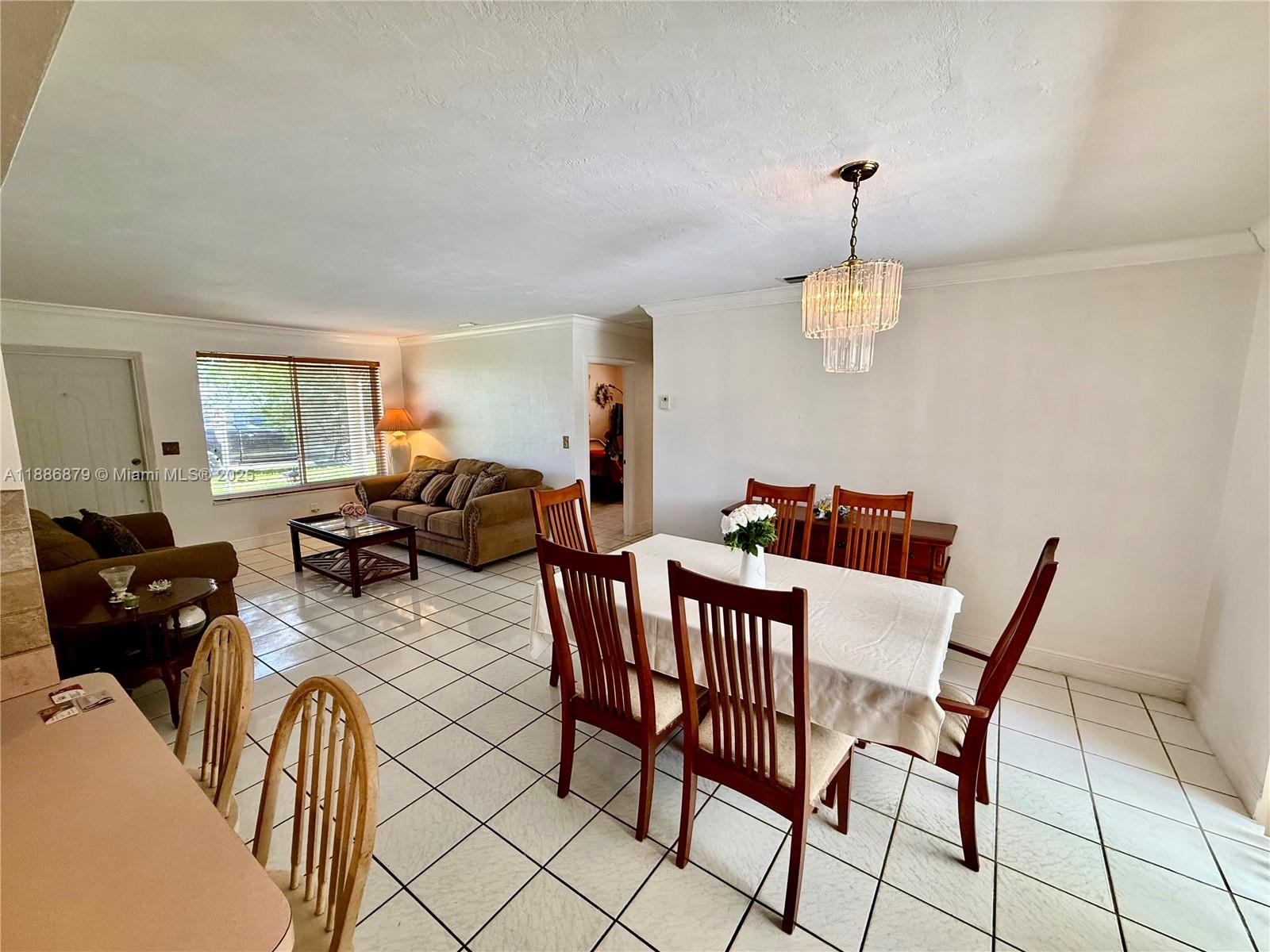 3310 Southwest 94th Place Miami, FL 33165 - Photo 10 of 24 a view of a livingroom and dining room