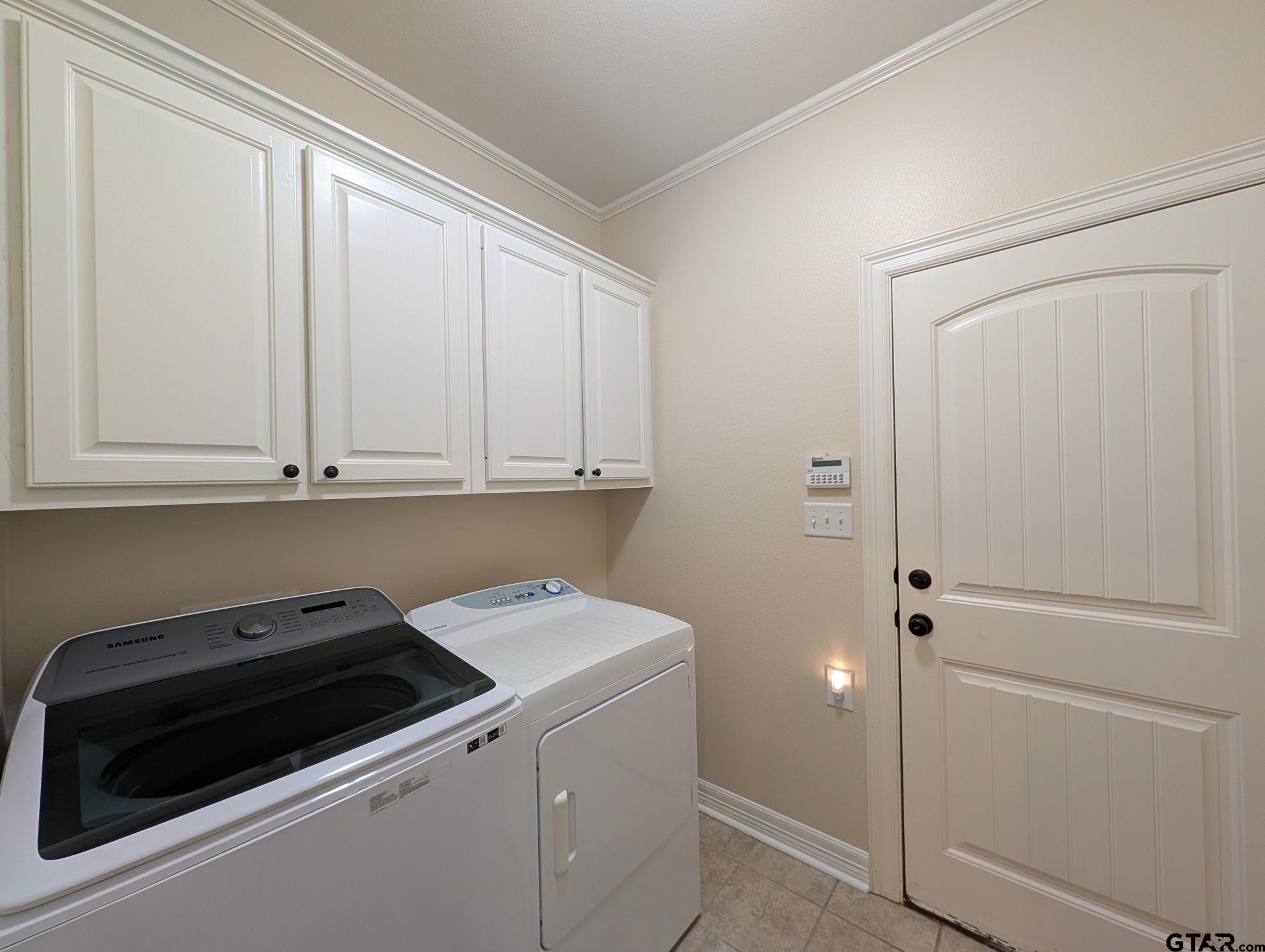 18488 Bluebird Circle Flint, TX 75762 - Photo 35 of 47 a view of storage and utility room with washer and dryer