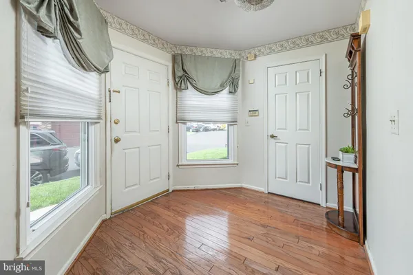 a view of an empty room with glass door