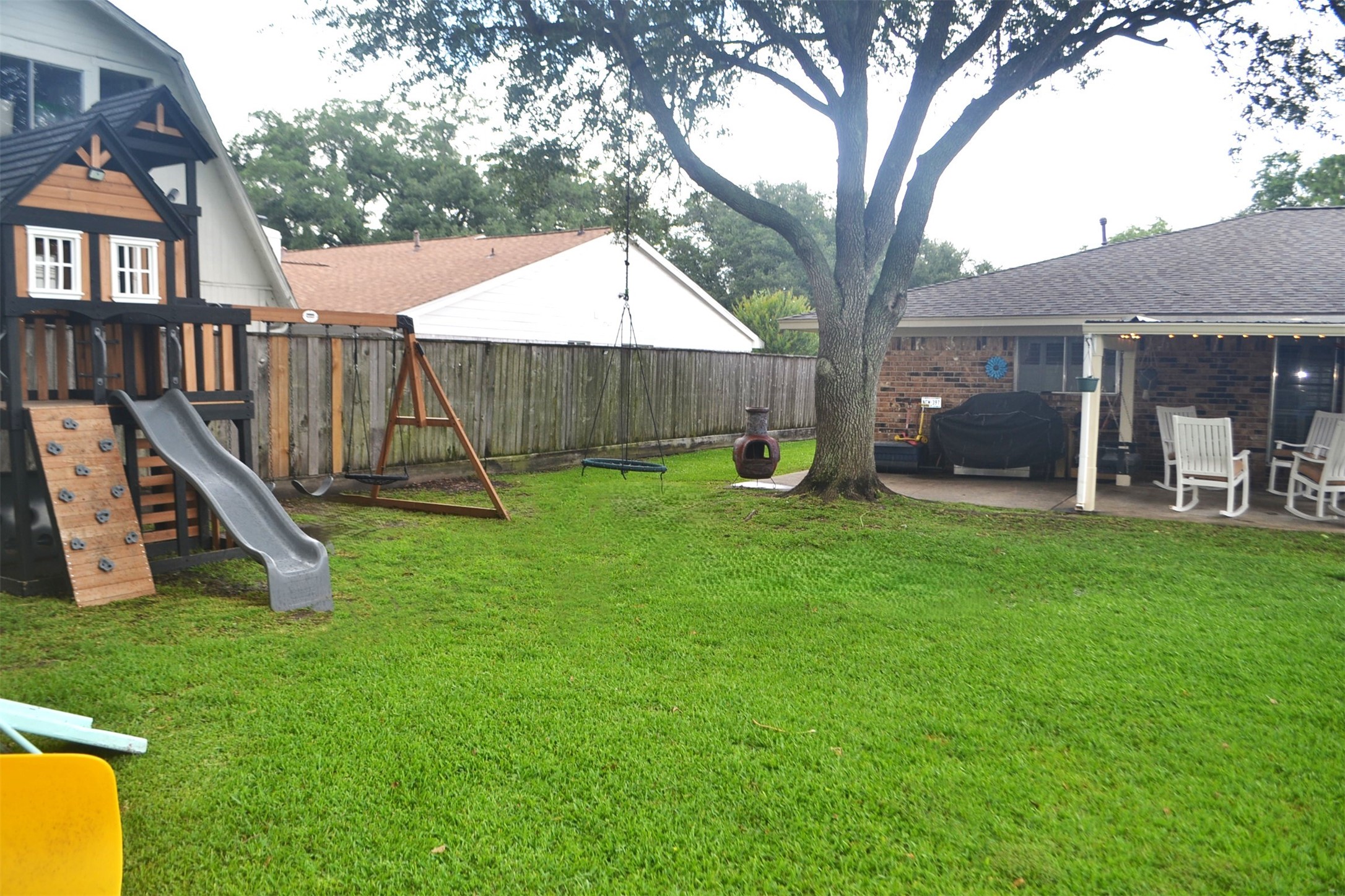 610 East X Street Deer Park, TX 77536 - Photo 39 of 44 a view of a house with backyard and a tree
