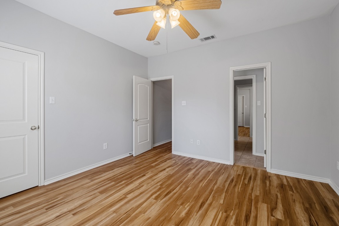 2906 Pearl Street, Unit C Austin, TX 78705 - Photo 13 of 25 Unfurnished bedroom featuring light wood-style flooring and ceiling fan