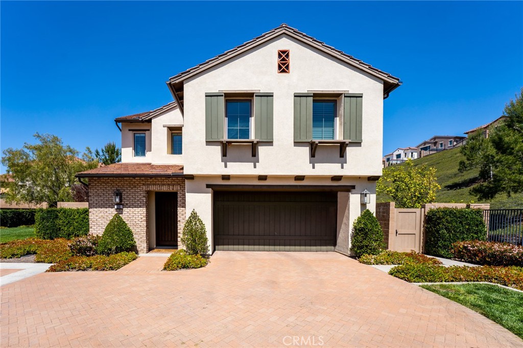 a front view of a house with yard