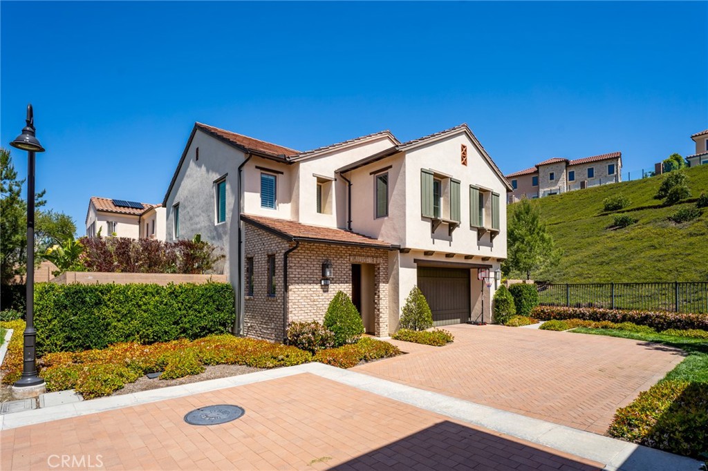 218 Oceano Irvine, CA 92602 - Photo 2 of 56 a front view of a house with a yard and garage