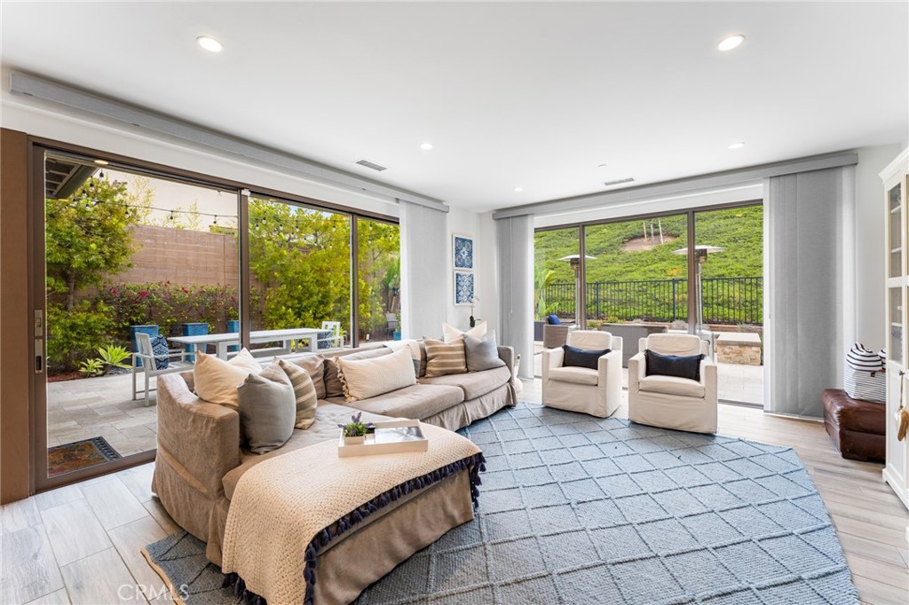218 Oceano Irvine, CA 92602 - Photo 26 of 56 a living room with furniture and large windows