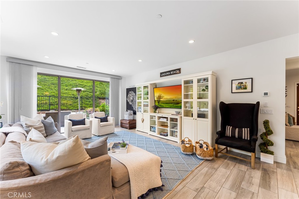 218 Oceano Irvine, CA 92602 - Photo 27 of 56 a living room with furniture and a flat screen tv