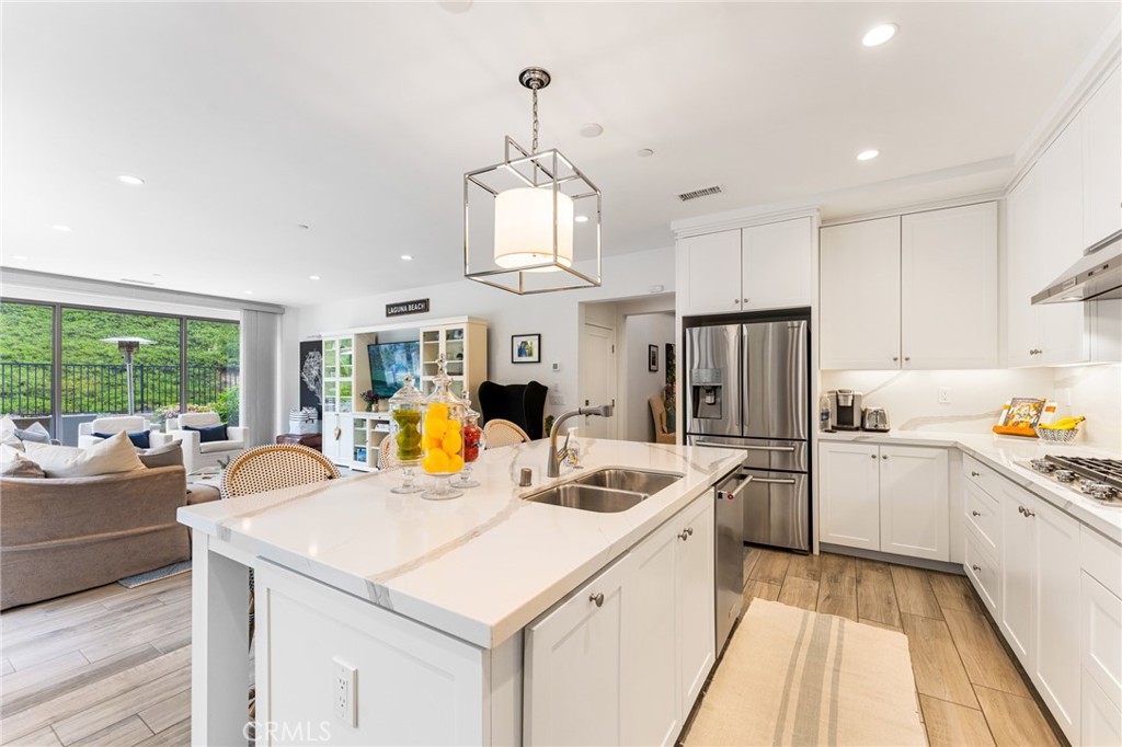 218 Oceano Irvine, CA 92602 - Photo 35 of 56 a kitchen with stainless steel appliances granite countertop a sink stove and refrigerator