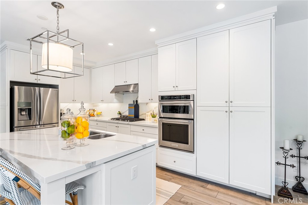 218 Oceano Irvine, CA 92602 - Photo 37 of 56 a kitchen with stainless steel appliances a stove sink and refrigerator