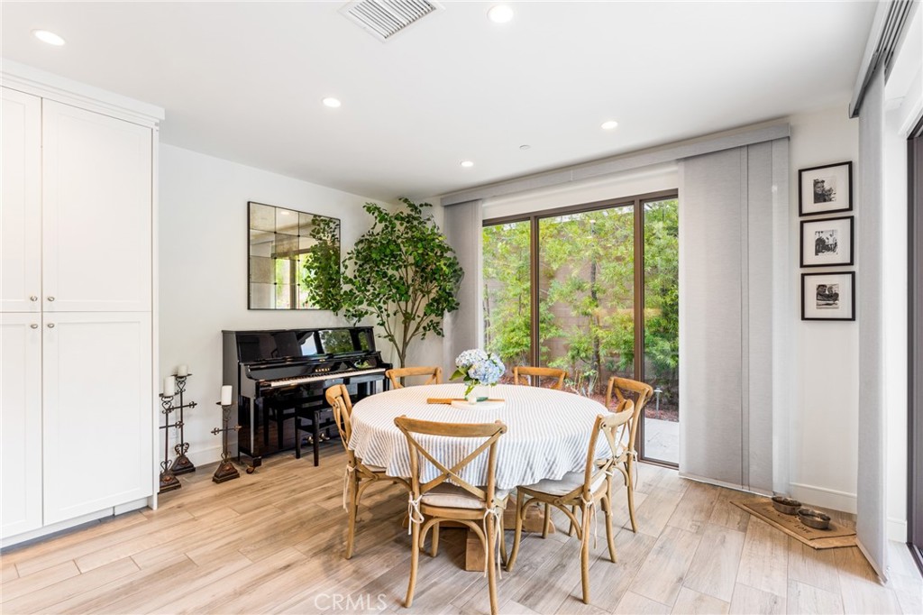 218 Oceano Irvine, CA 92602 - Photo 38 of 56 a view of a dining room with furniture window and wooden floor