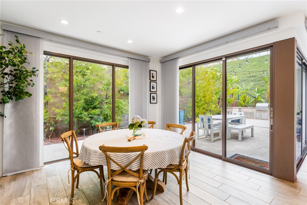 218 Oceano Irvine, CA 92602 - Photo 39 of 56 a view of a dining room with furniture window and wooden floor