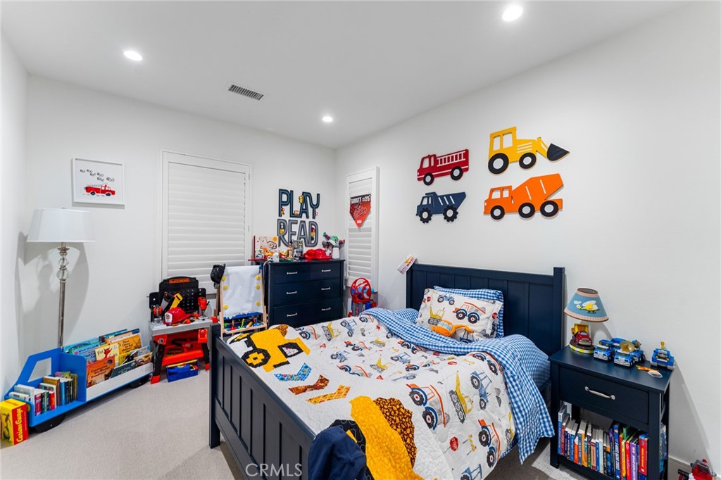 218 Oceano Irvine, CA 92602 - Photo 46 of 56 a bedroom with a bed and dresser