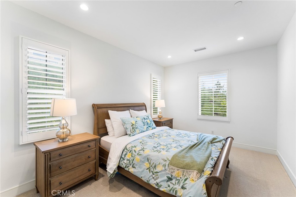 218 Oceano Irvine, CA 92602 - Photo 47 of 56 a bedroom with a bed and a window