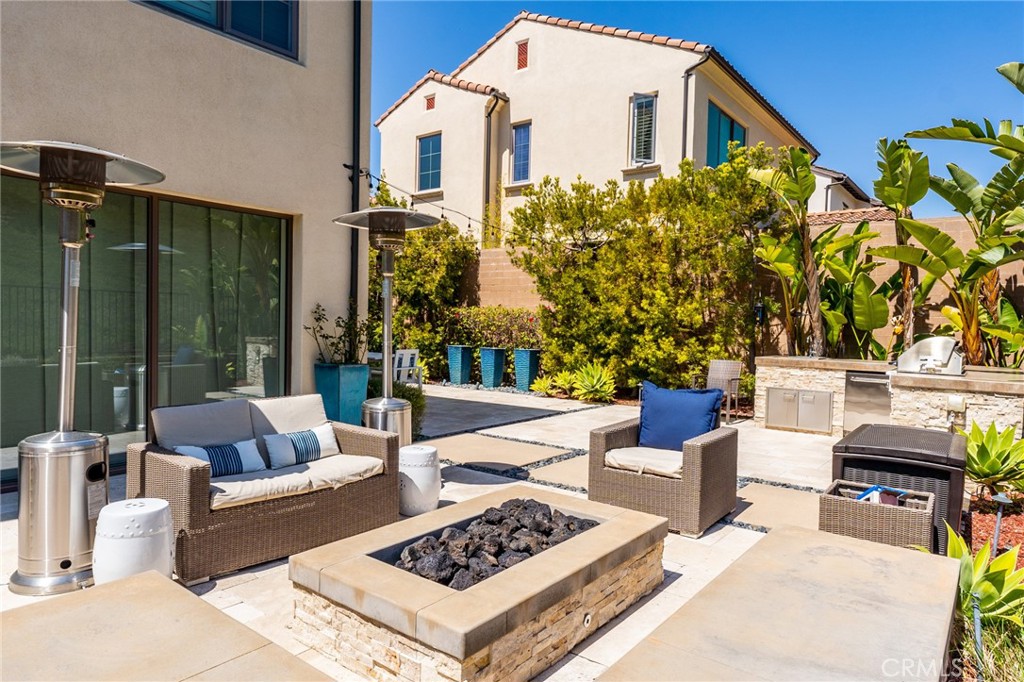 218 Oceano Irvine, CA 92602 - Photo 5 of 56 a view of a patio with couches table and chairs and potted plants