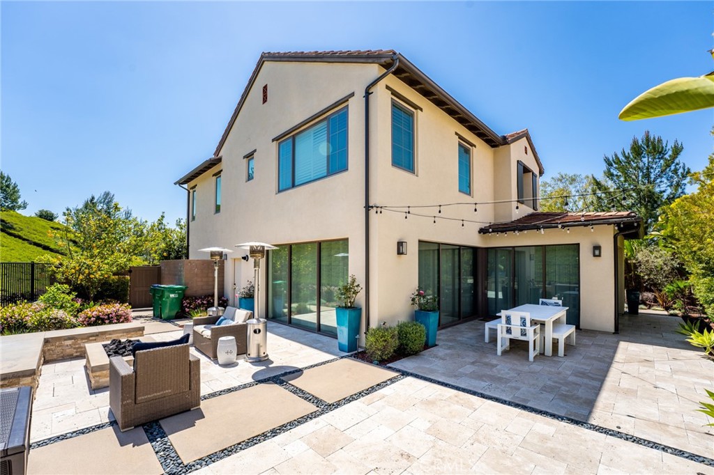 218 Oceano Irvine, CA 92602 - Photo 7 of 56 a building outdoor space with patio furniture and potted plants