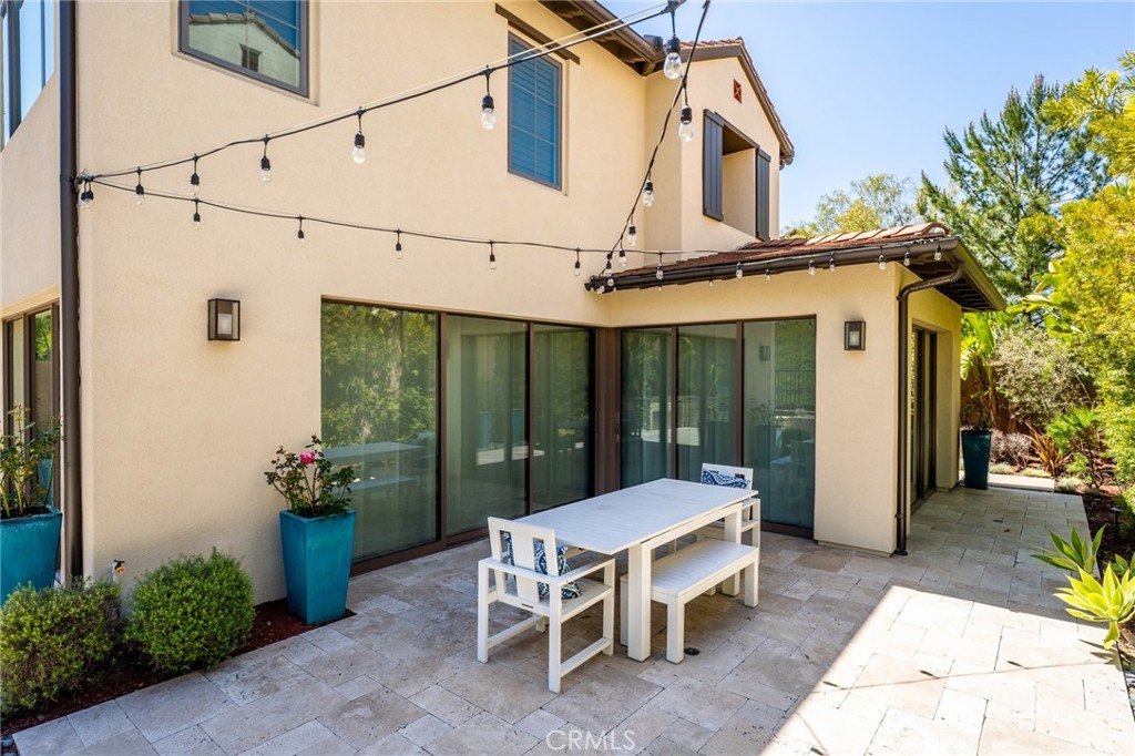 218 Oceano Irvine, CA 92602 - Photo 8 of 56 a view of a patio with table and chairs and potted plants