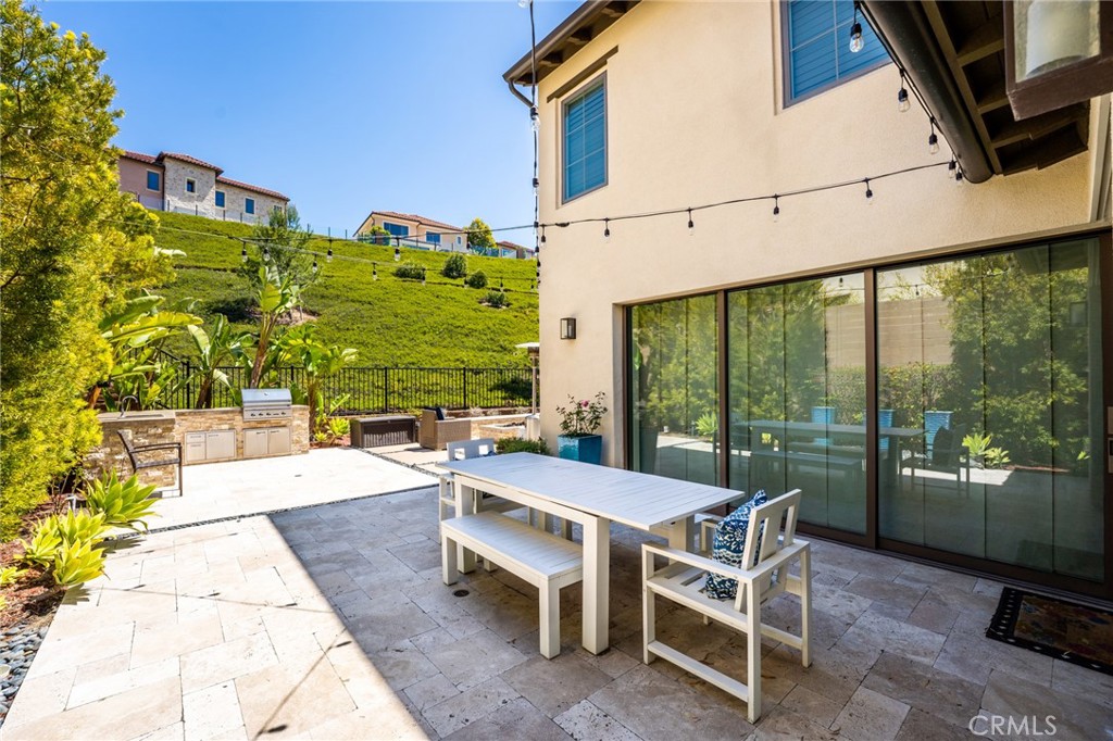 218 Oceano Irvine, CA 92602 - Photo 9 of 56 a view of a patio with a table and chairs