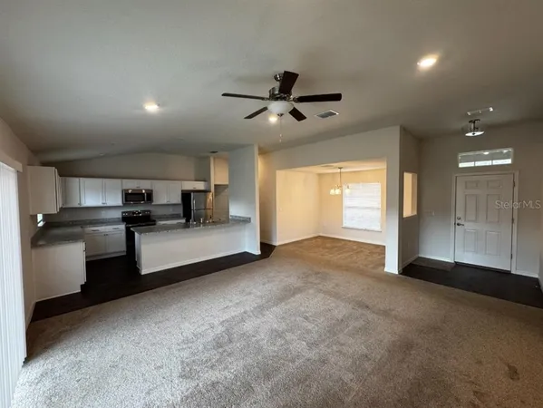 a view of a kitchen with a sink and dishwasher