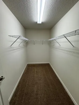 a view of a room with racks on the wall